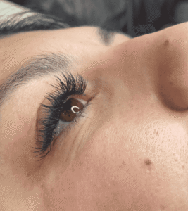 Close-up of eye with long eyelashes.