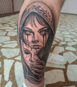 Detailed tattoo of woman with cracked mask
