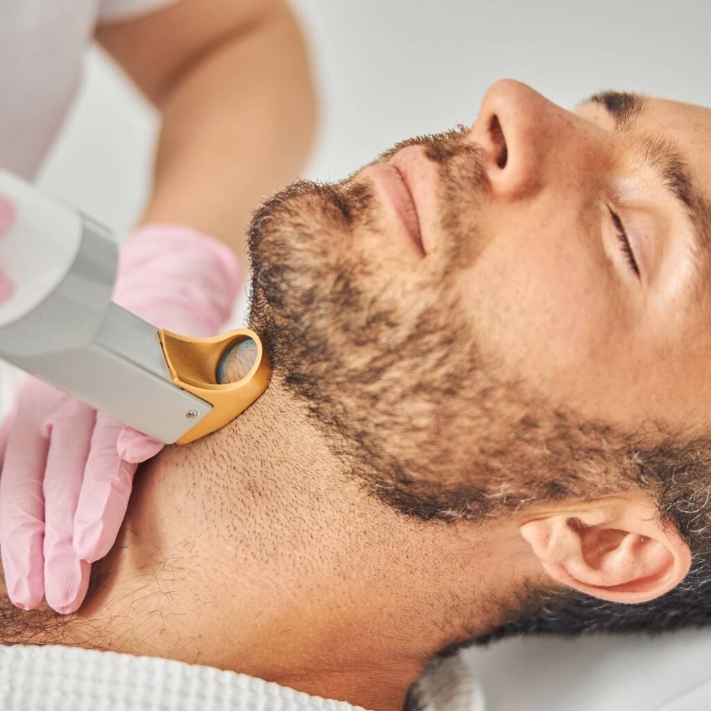 Man receiving laser beard treatment.