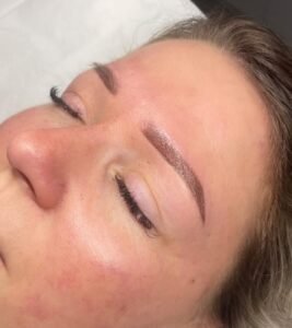 Close-up of woman after eyebrow microblading.