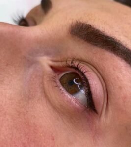 Close-up of eye with natural lashes and makeup