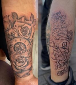 Tattoo art: roses, clock, comedy-tragedy masks.